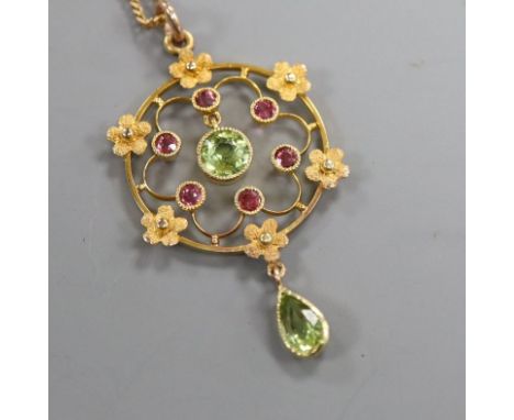 A peridot and amethyst openwork gold pendant (tests as 14ct) on fine chain, pendant 4cm. pendant 38mm.