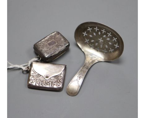 A George IV silver vinaigrette, Thomas Shaw, Birmingham, 1828, a Georgian silver caddy spoon and a 925 stamp case.