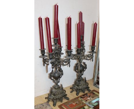A pair of Victorian cast spelter four branch five light candelabra
