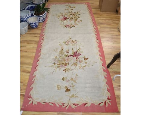 An Aubusson style carpet 320 x 125cm