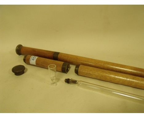 A PAIR OF UNUSUAL LIGHT OAK AND BRASS WALKING CANES WITH INTERIOR SPIRIT FLASKS AND MINIATURE DRINKING GLASSES, LENGTH 92 AND