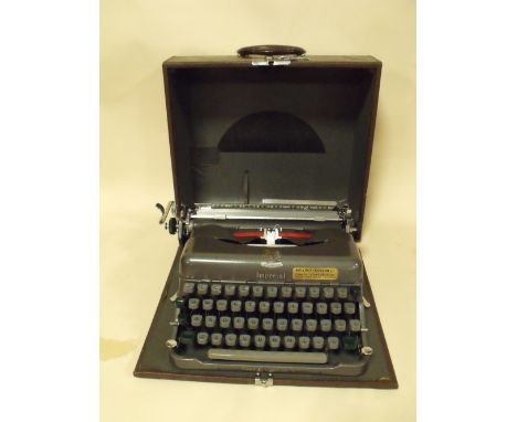A CASED VINTAGE IMPERIAL TYPEWRITER