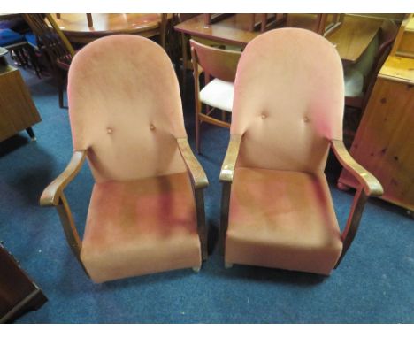A PAIR OF VINTAGE OAK FRAMED UPHOLSTERED ARMCHAIRS