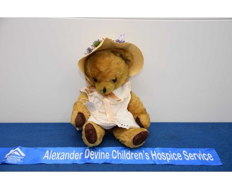 A post war Teddy Bear, AF, possibly Pedigree, in bonnet and dressed, signs of repair, thank you for looking at this lot which