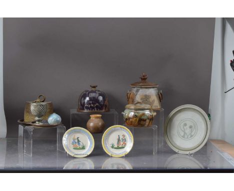 A collection of stoneware studio pottery, including two cheese dishes and covers, both with ash and iron glaze, together with