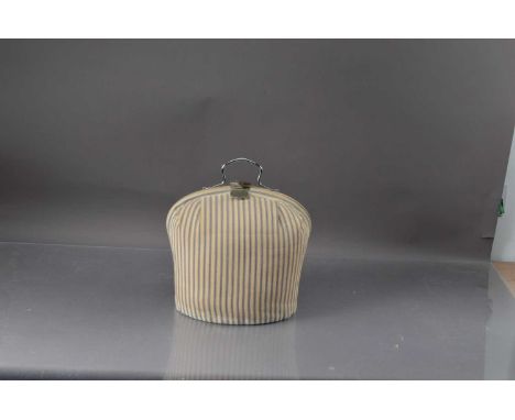 A Vintage cloth and chrome plated tea cosy, with blue and white stripped design 35 cm high, thank you for looking at this lot