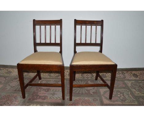 A pair of Regency side chairs with reeded mahogany backs, the drops seats upholstered in pale yellow silk moire, thank you fo