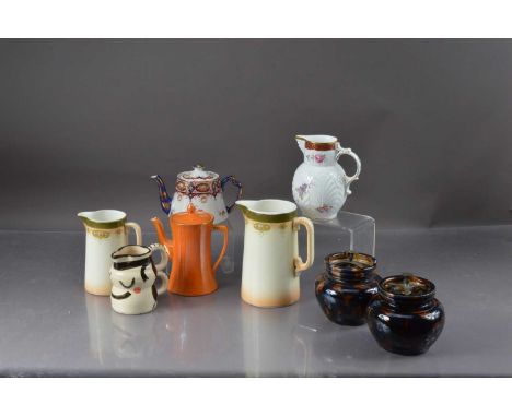 A pair of stoneware tobacco jars, together with a orange lustre coffee pot, Coalport mask ware jug and others, thank you for 