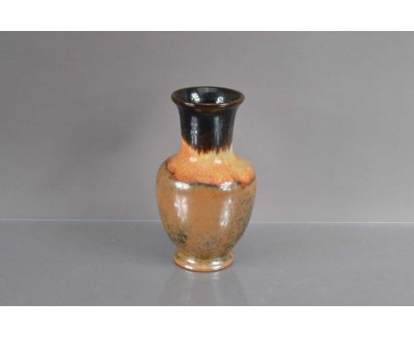 A 20th Century Japanese art pottery vase, treacle coloured brown drip glaze. Appears to be in good condition. 21 cm high, tha