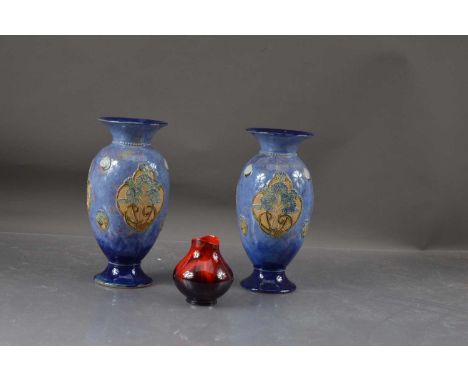 Royal Doulton Royal Doulton, Tube lined, Urn shaped, x2 vases and a red flambout squat vase Thank you for looking at this lot