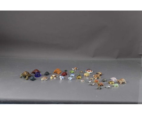 A collection of tortoises models, including rose quartz, hard wood, shells, and others, thank you for looking at this lot whi