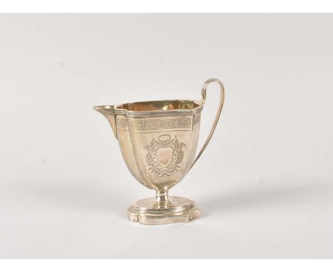 A Georgian style milk jug, filled base, with engraved design and gilt interior, not hallmarked but appears to be silver, 7.32