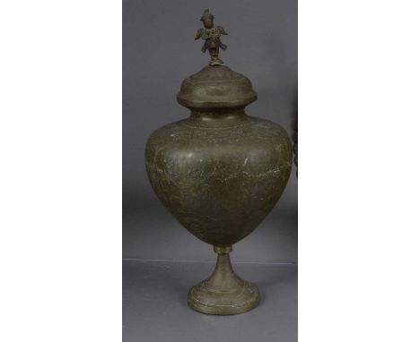 A large Indian brass lidded vase, the lid with a finial modelled as Garuda, the vase and cover 55 cm high, thank you for look