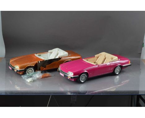 Two Mattel Barbie convertible Jaguar sports cars, one in cerise pink, the other gold example, badly damaged, thank you for lo