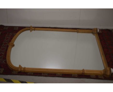 A large Victorian over mantel pitch pine architectural mirror, original oval pressed metal trade label verso for 'Edwin Strin