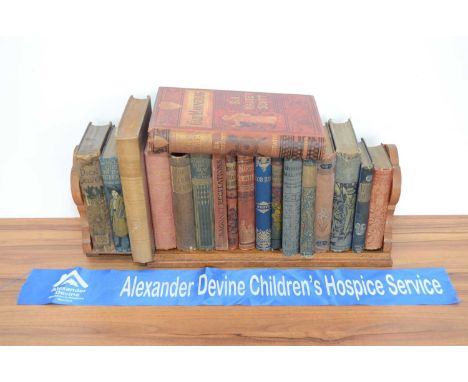 A Victorian oak book trough and 18 books, various titles. Thank you for looking at this lot which is being sold on behalf of 