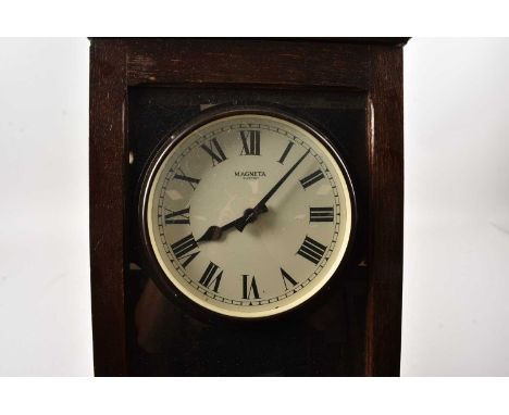 A large Magneta oak cased Electric wall clock, thank you for looking at this lot which is being sold on behalf of The Alexand