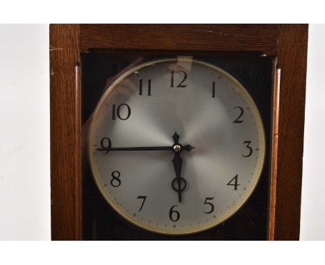 A large Gent oak cased Electric wall clock, thank you for looking at this lot which is being sold on behalf of The Alexander 