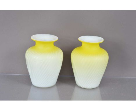 A pair of Victorian canary yellow and white satin glass "Pompeian Swirl" air trap vases, possibly by Stevens and Williams of 