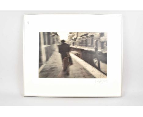 Photograph, a cool black and white photograph of a figure walking next to a canal, possibly Venice, signed and dated 1993, th