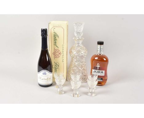A nice cut glass decanter and six liquor glasses, together with an opened bottle of Jura single malt whisky and a boxed bottl