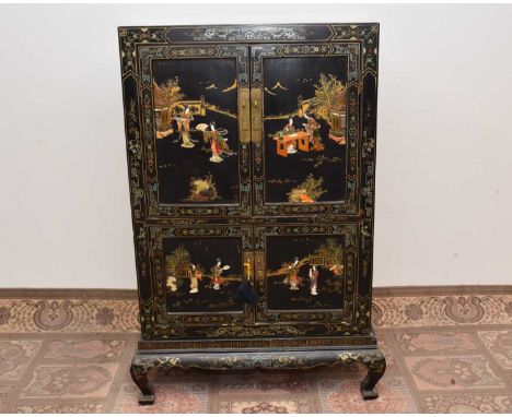 A late 19th century or early 20th century Japanese black lacquer and inlaid cabinet on stand, As found, 150cm high and 202cm 