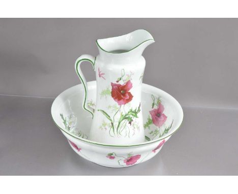 A large and good quality pottery jug and basin by Maple, transfer printed decoration with poppy flowers. England early 20th C