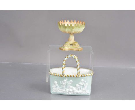 Two Royal Worcester items including an entwined dolphin crenellated bowl in blush ivory, and a relief moulded flower basket d