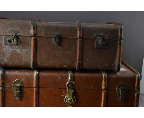 Two steamer trunks, both with laminated beach bands, brass clasps, and banding, thank you for looking at this lot which is be