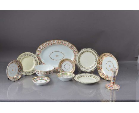 An early 19th century Derby porcelain part dinner set, comprising a small candlestick, circular and oval dishes, with painted