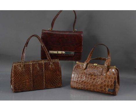 Three vintage mid-20th Century lady's handbags, one in crocodile skin, one in alligator by Fassbender and the third in snakes