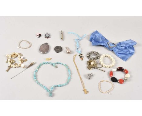 A small group of jewellery and other items, including a large silver locket, a silver scent bottle pendant, and a silver Hock