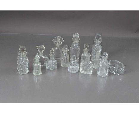A collection of cut and moulded glass scent bottles twelve with stoppers one vacant and a table salt oval pot, thank you for 
