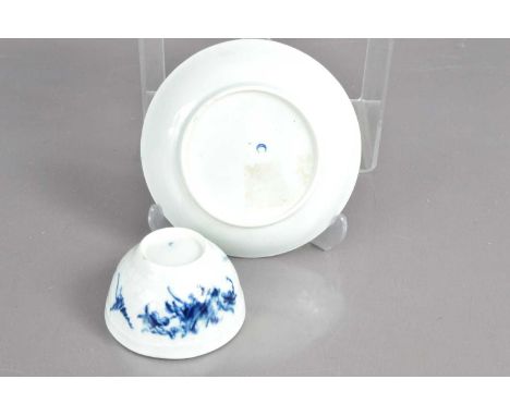 An 18th Century early English porcelain tea bowl and saucer circa 1770s, blue and white decoration, hand-painted with leaves,