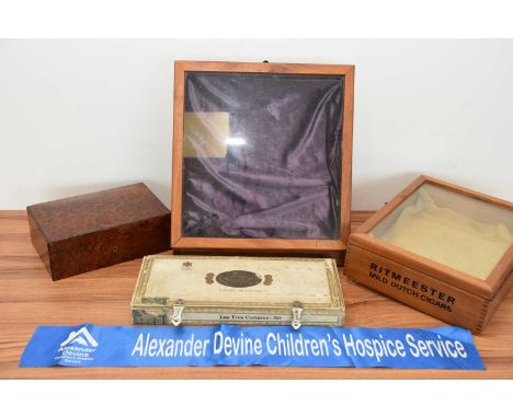 Three cigar related boxes and a small tabletop display cabinet, including a wooden and glass vitrine with stencil for Ritmees