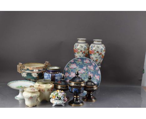 A pair of pottery vases, ovoid shape with transfer printed decoration, modern black garniture, two biscuit barrels one missin