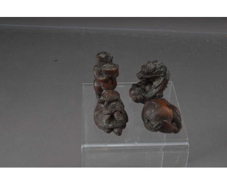 4 Japanese box wood carved netsuke, including a pig standing with a bowl with bird and flower, 3 tortoise and a dragon. Pig 5