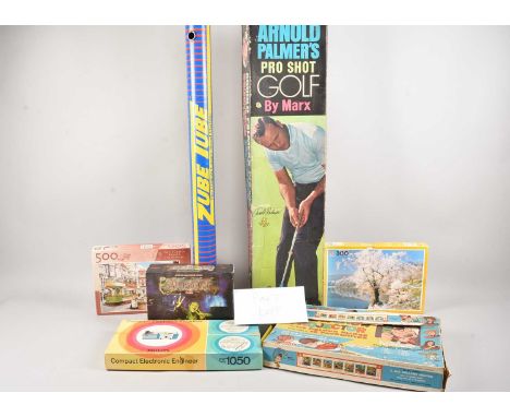 A collection of games and jigsaws, As Found, including An Arnold Palmer Pro Shot Golf by Marx in box, a Zube Tube, Atmosfear 