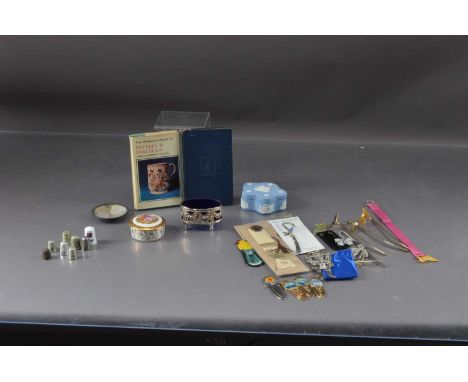 A selection of bookmark and thimbles, including examples in metal and porcelain together with two trinket boxes and a blue gl