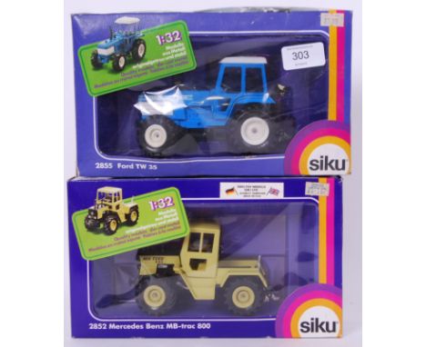 SIKU: Two Siku diecast detailed model tractors - 2852 & 2855. Both models mint, within the original boxes. 