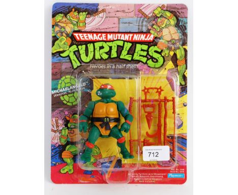TEENAGE MUTANT NINJA TURTLES: An original vintage 1990's Playmates made Teenage Mutant Ninja Turtles 10 back carded Michaelan