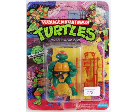 TEENAGE MUTANT NINJA TURTLES: An original vintage 1990's Teenage Mutant Ninja Turtles first release 10 back action figure ' M
