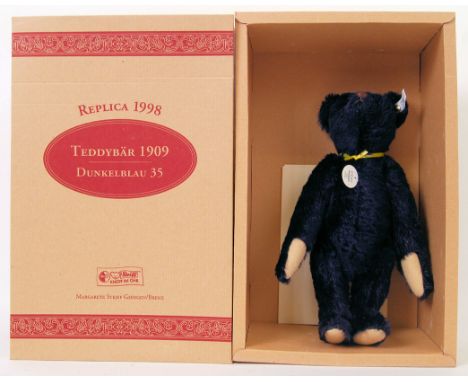 STEIFF: An original Steiff ' Replica ' 1909 teddy bear. 36cm tall. Blue mohair fur, with pronounced snout. Within the origina