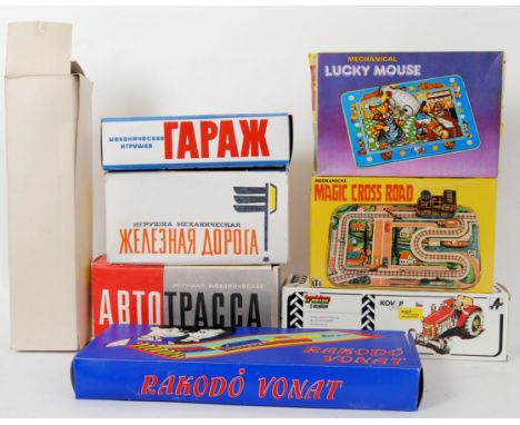 TINPLATE: A collection of 8x vintage Russian / Japanese made tinplate clockwork vehicles and track based toys. Comprising of;