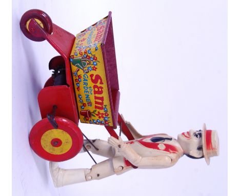 MARX SAM THE GARDENER: A rare vintage Marx Toys tinplate clockwork ' Sam The Gardener ' toy. Working order. 20cm tall.