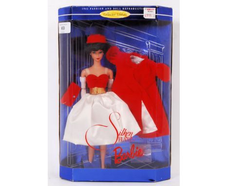 BARBIE: An original Mattel made special edition Barbie doll - Silken Flame - 1998 reissue of a 1962 Fashion Doll Barbie. Excl