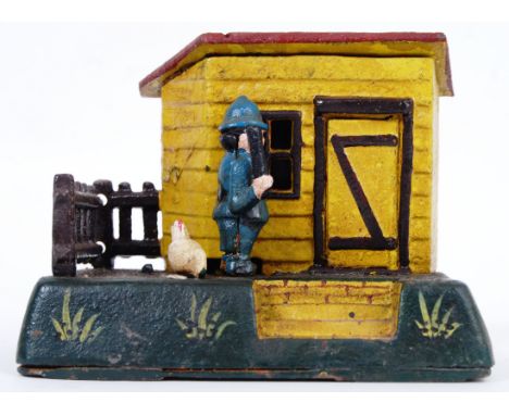 MONEY BOX: A vintage Victorian style 20th century cast iron hand painted automaton style money box in the form of an arrestin