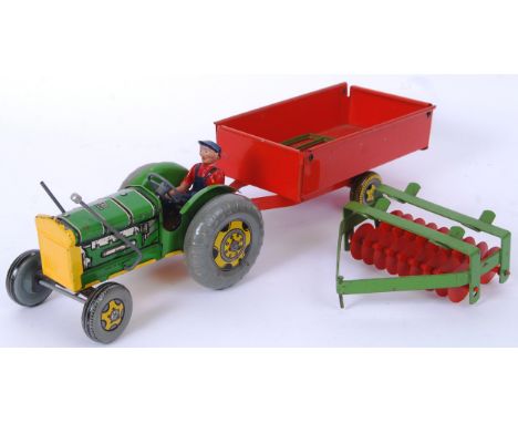 METTOY: A charming vintage Mettoy tinplate clockwork tractor, trailer and plough. Working order. Generally good, with minor w
