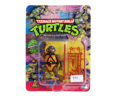 TEENAGE MUTANT NINJA TURTLES: An original vintage 1990's Teenage Mutant Ninja Turtles first release 10 back action figure ' D