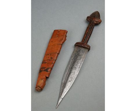 A Vintage African Dagger With Stitch Detailing To Blade Together With Original Leather Sheath. 